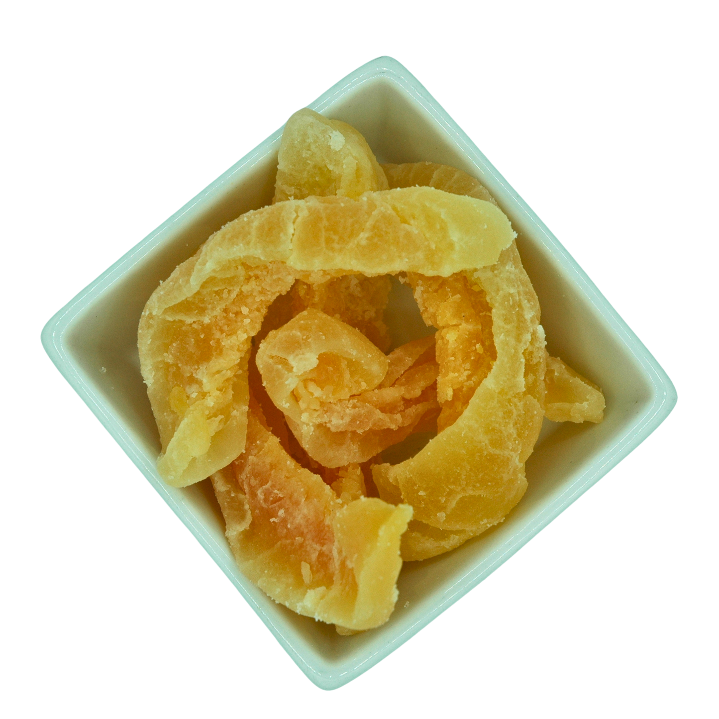 Dried cantaloupe melon chunky slices in a white bowl on a white background