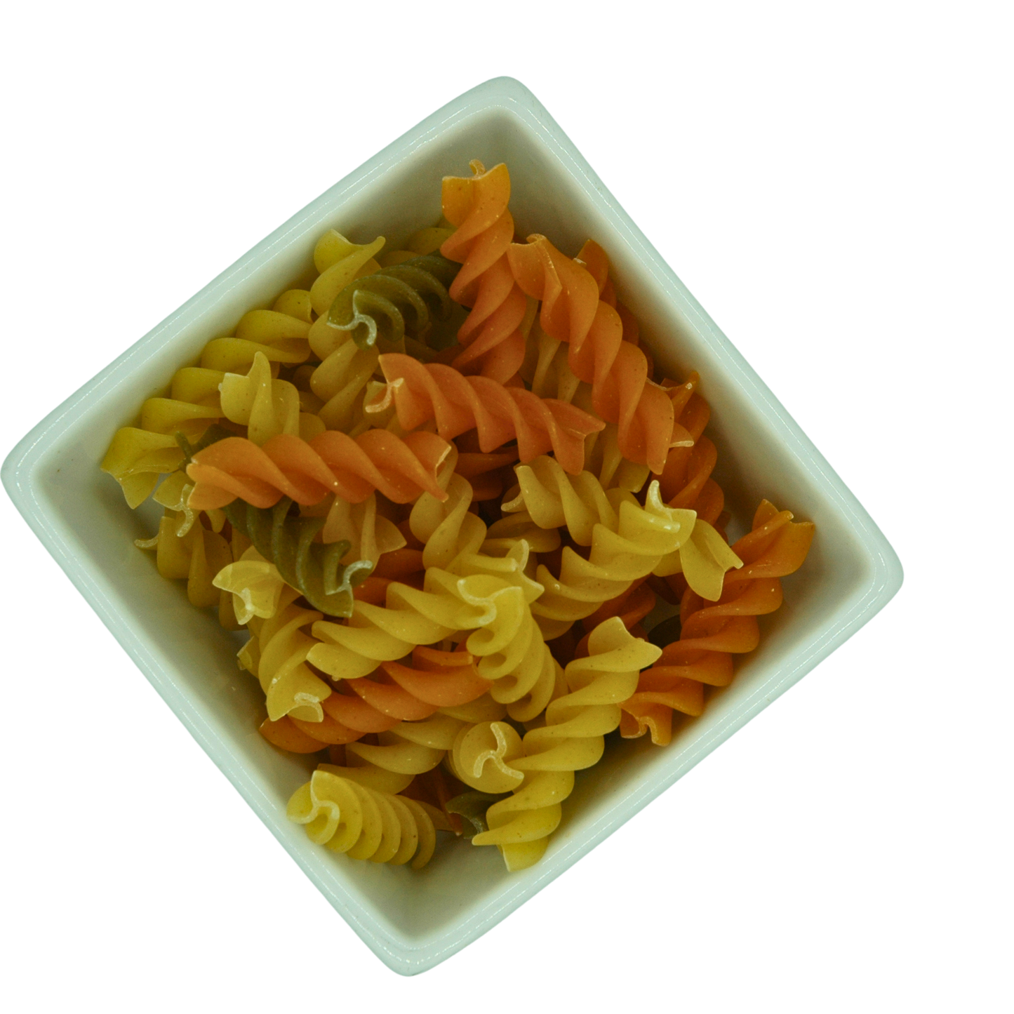 Colorful fusili pasta in a white bowl on a white background