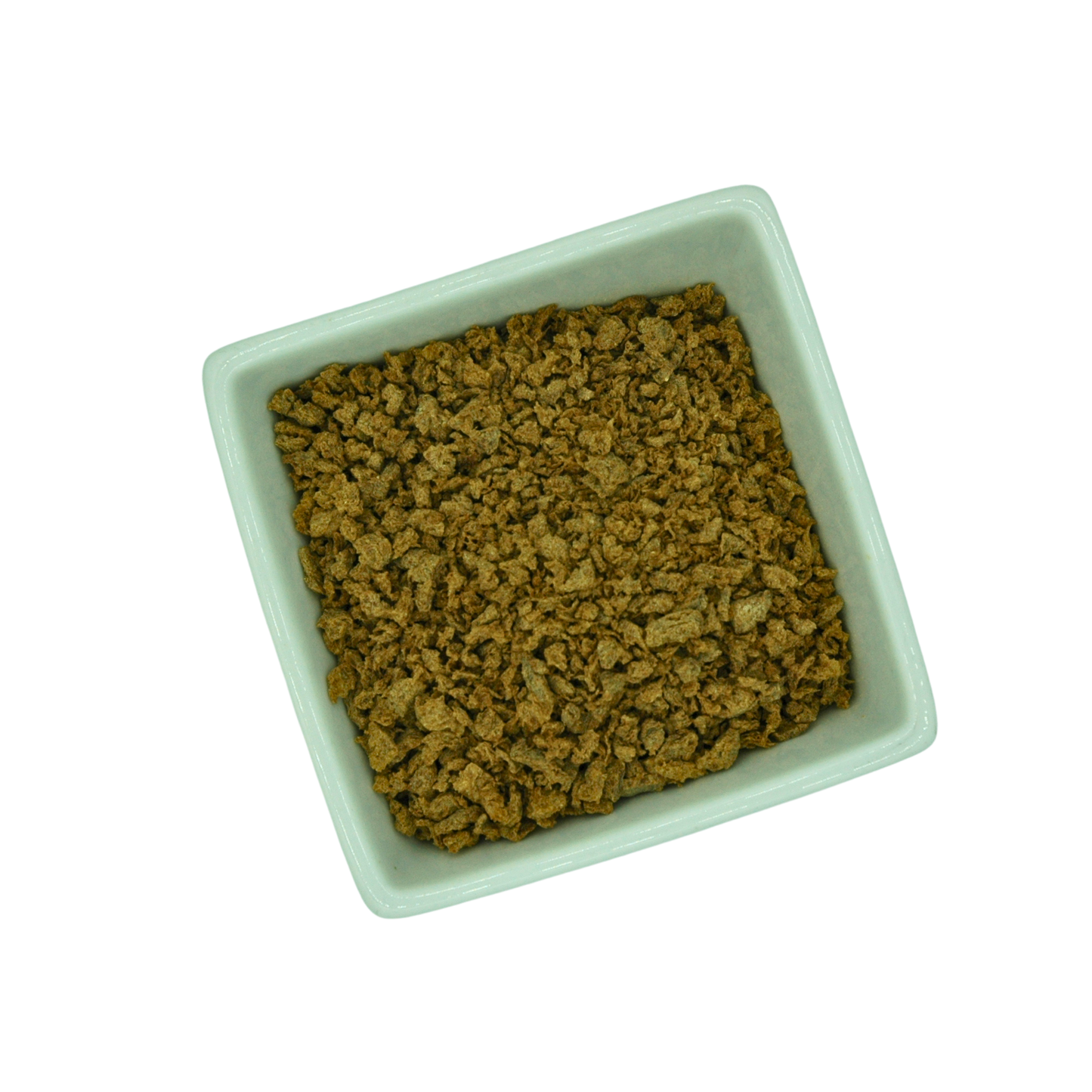 Square white bowl filled with dried tvp mince on a white background