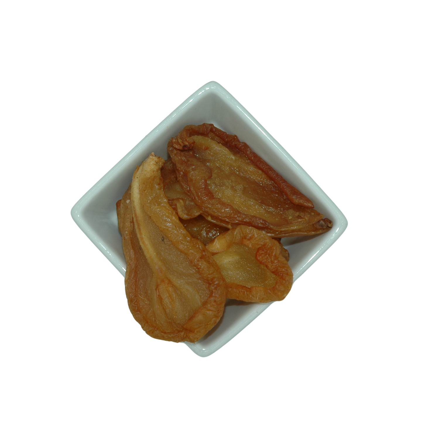 Dried pear halves in a white square bowl on a white background