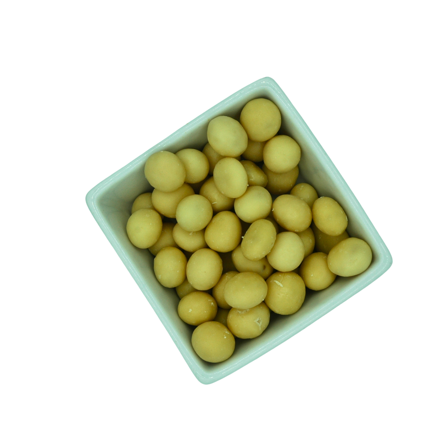 White bowl filled with yellow round yoghurt covered dried fruit on a white background