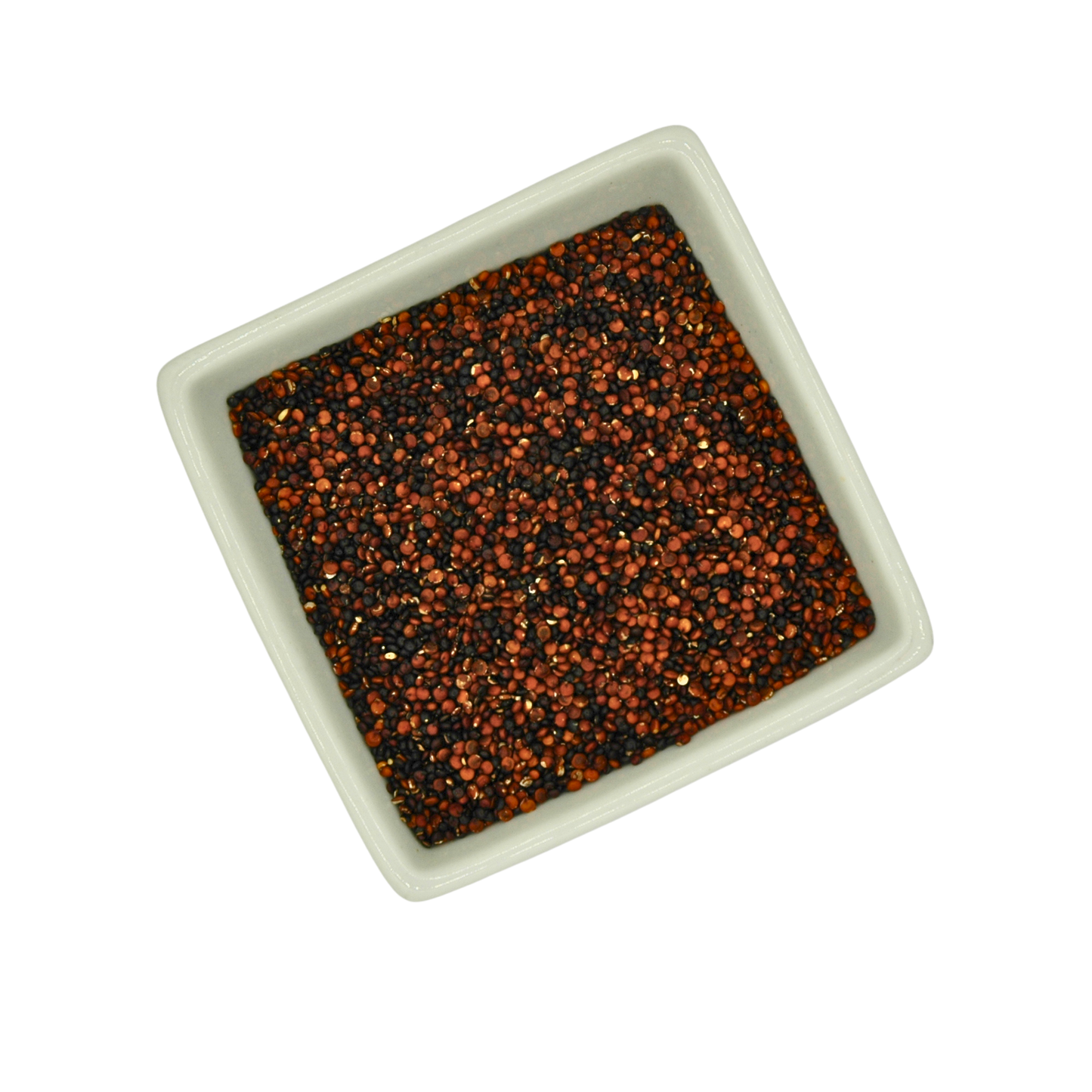Square bowl filled with black and red speckled quinoa on a white background