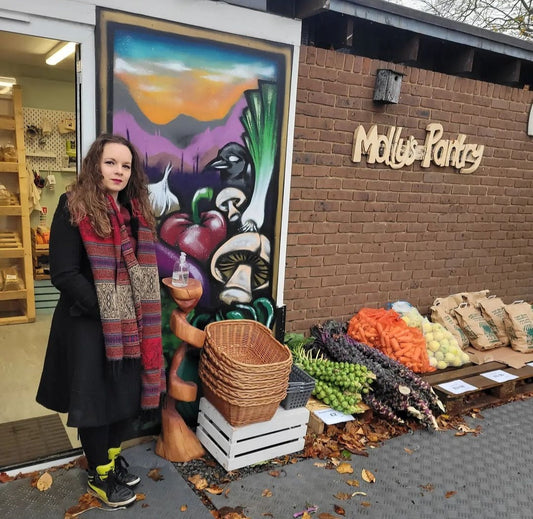 molly stood outside the old shop in autumn