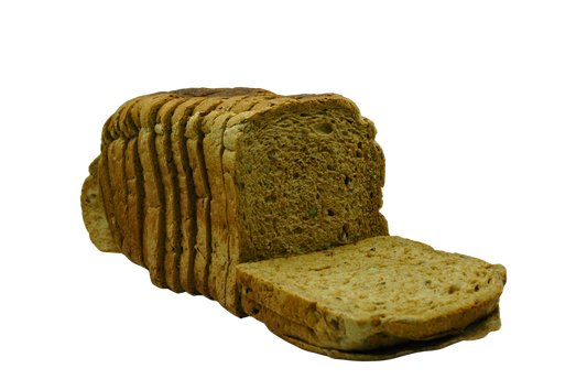 Loaf of whole wheat seeded bread sliced on a white background