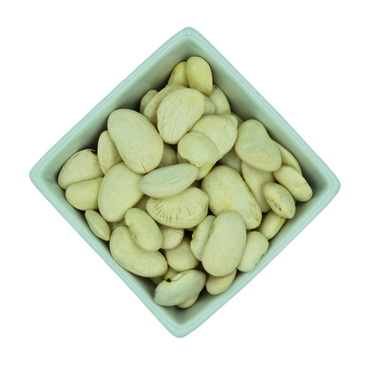White beans in a green bowl on a white background
