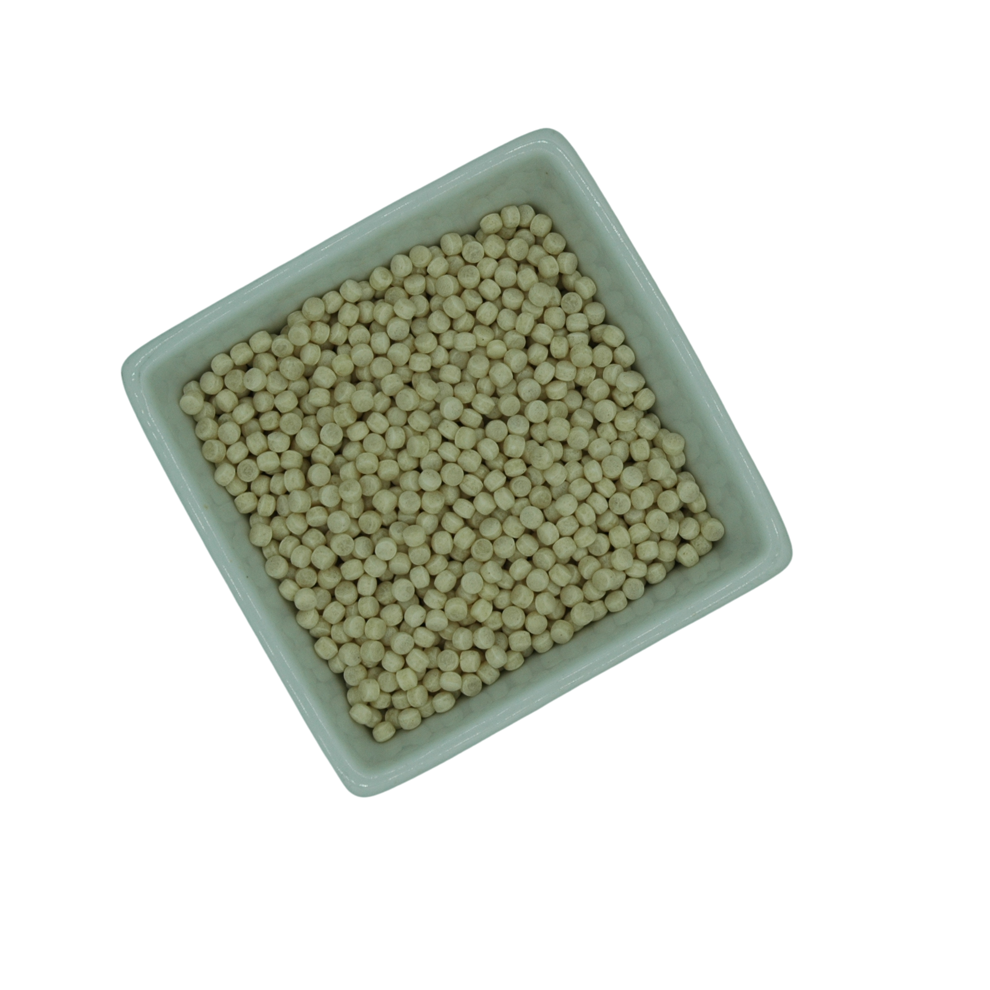 Square white container filled with large couscous grains on a white background