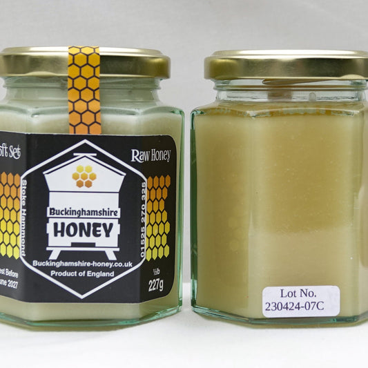Two jars of honey with a Buckinghamshire Honey label on a white background