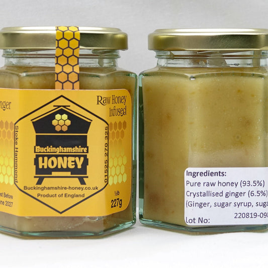 Two jars of Buckinghamshire Honey with labels on a white background