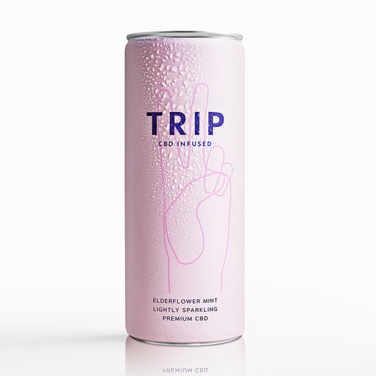 Pink can with 'TRIP' branding on a white background