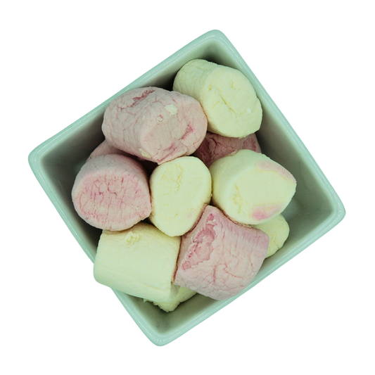 white bowl filled with pink and white vegan marshmallows on a white background