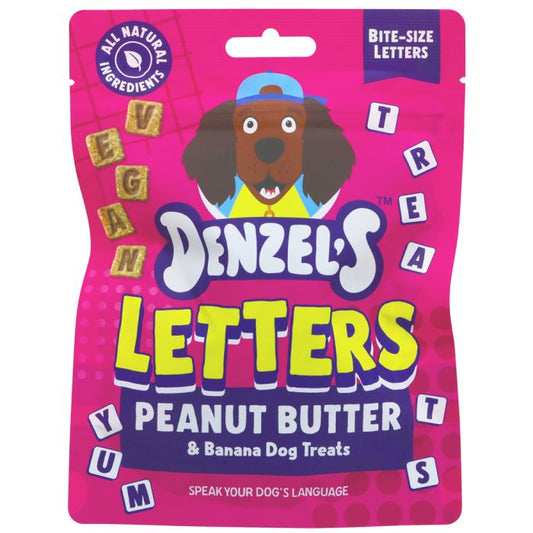 A package of Denzel's Letters Peanut Butter & Banana Dog Treats, featuring a bright pink bag with a cartoon dog wearing a blue cap and colorful letter-shaped treats.