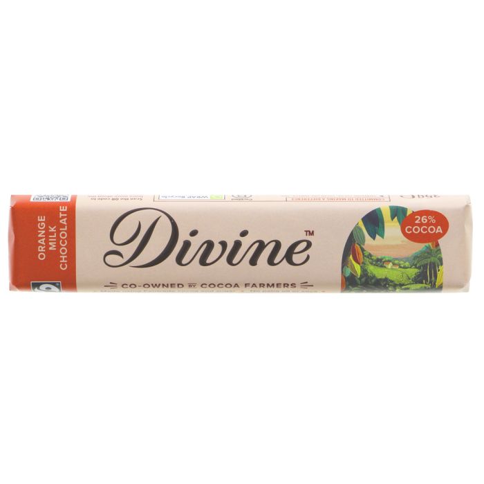A wrapped bar of Divine Orange Chocolate on a plain white background. The packaging features a light beige background with a prominent orange band on the left, the brand name 'Divine' in black script, and a colorful illustration of a cocoa plantation on the right with a red '26% Cocoa' badge.