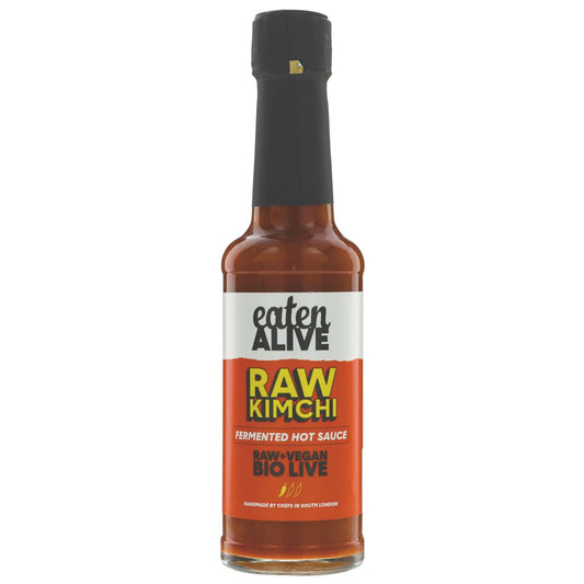 Bottle of 'Eaten Alive Raw Kimchi' fermented hot sauce on a white background