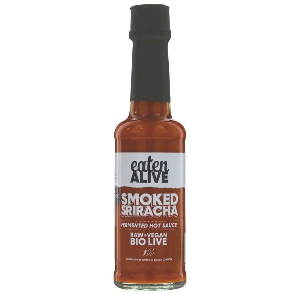 Bottle of smoked sriracha sauce with a black cap on a white background made by eaten alive