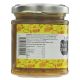 A jar of honey with a yellow label and a clear glass container, shown against a white background.