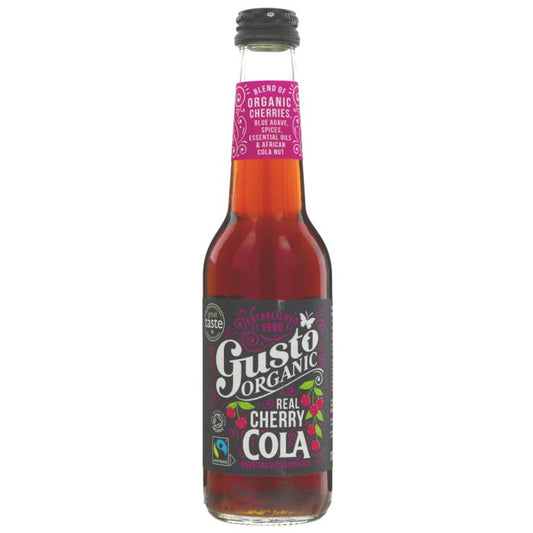 A bottle of Gusto Organic Real Cherry Cola on a plain white background. The glass bottle shows the reddish-brown cola liquid inside, with a black cap and a black label featuring white and pink text and cherry illustrations.