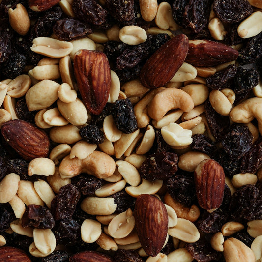 Assorted nuts and dried fruits including almonds, cashews, and raisins.