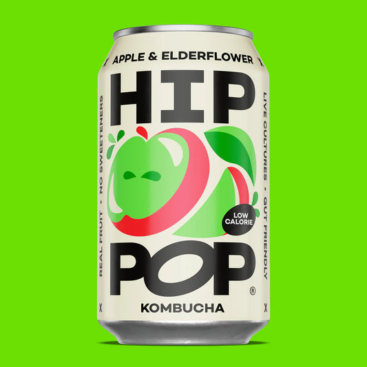 Can of HIP Pop Kombucha with apple and elderflower design on a green background