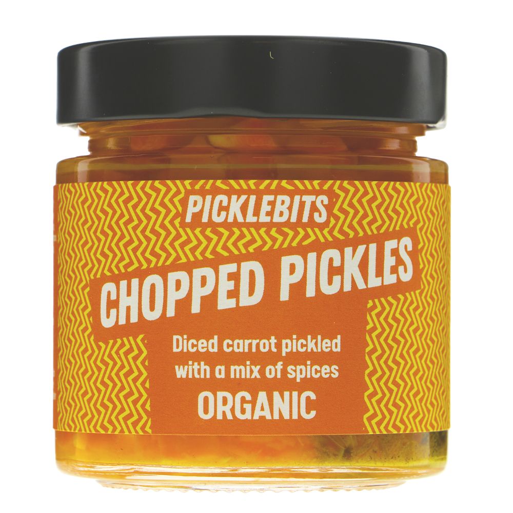 A jar of Picklebits Chopped Pickles, organic diced carrot pickles with a mix of spices, featuring a black lid and a yellow and orange label, shown on a white background.