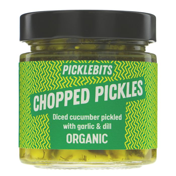 A jar of Picklebits Chopped Pickles, featuring a green and yellow patterned label with white text, a black lid, and visible yellow-green pickled contents in a clear glass jar.