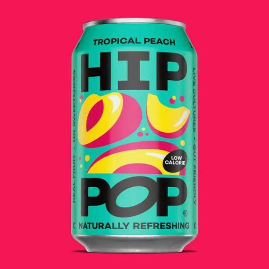 Can of Hip Pop Tropical Peach soda on a pink background