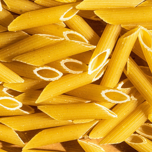Close-up of yellow penne pasta