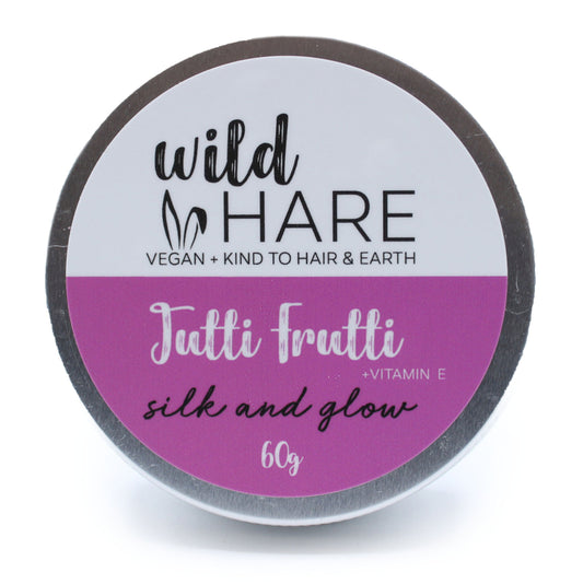 Jar of 'wild HARE' hair product with 'Tutti Frutti' flavor on a white background